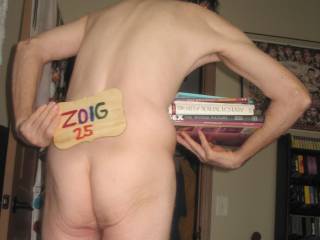 A partial body view that includes my butt as I stand in my bed room...A Powershot G6 camera was used.