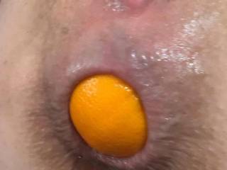 Babygirl has four mandarins stuffed up her beautiful little ass but says she has room for more. This is when I used my cock to push these deeper into her asshole making room for four more!