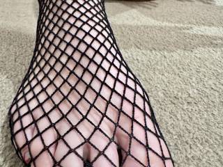 My feet wrapped in fishnet