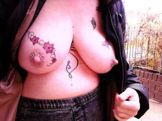 Showing of her nipple jewellery in public. Sally in a local street.