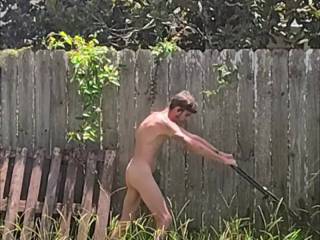 Mowing my back yard. Privacy fence all around
