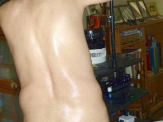A partial body standing view that includes part of my butt... I am about adjust a S70 camera that`s mounted on a pole near my recliner...late April 2025. FZ 100 camera was used.