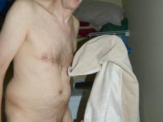 A partial body frontal as I stand holding my pet blanket near my dryer...May 3RD 2025... FZ 100 camera was used.