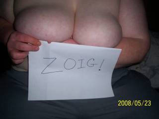 My friend helping me with a Zoig sign pic of her titties