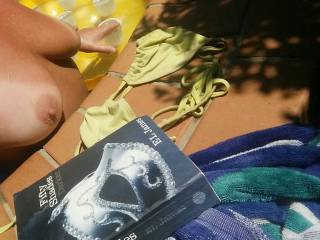 Laying on floatie reading my book.. But got too horny  so bikini  top had to come off! Hope you aren\'t complaining??