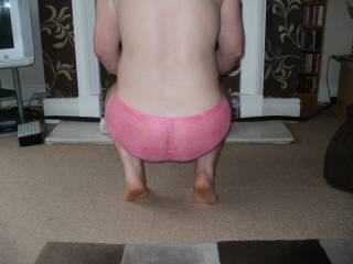 rear view of me crouched down in pink panties