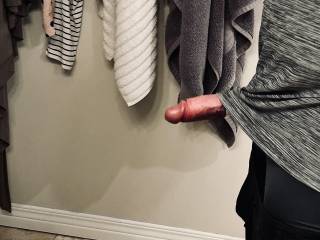 My rock hard cock is poking out from under my shirt