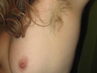 I cannot resist the combination of lovely curls and a naked breast