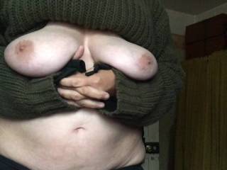 Standing holding up tits