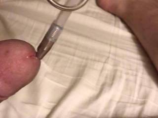 I’m enjoying sliding this nice long hollow plug into my cock... damn it feels good. Now all I need is my baby girl to stroke me until I cum... when I do, it shoots hard out of that little hole.