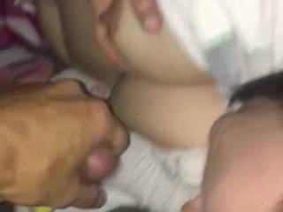 Using my tongue with his cock while playing with my boobs waiting for his cum