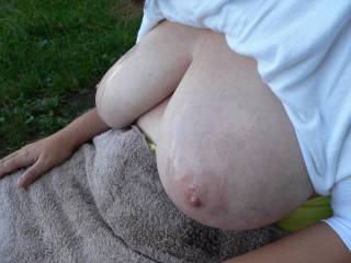 About to get them massaged from behind while she is on a bench
