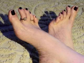I think her feet are very sexxy and love when she loves me with them. Love her toe rings and her long thin toes.