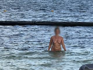 My wife went for a solo dip in the ocean after riding my cock on the beach palapa at Desire Resort. 1 of 3