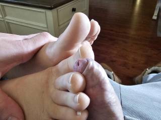 Stroking a pre cummy cock with my toes