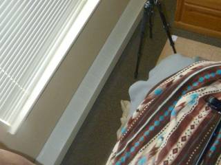 A partial lower body view as I stand near my bed and window blind with a G6 Canon camera on a tripod...on May 1ST 2025... FZ 150 camera was used.