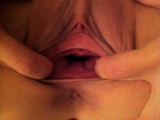 She is opening wide so show off her slutty cunt.  hmmmmm i love when she is a slut