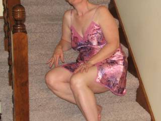 On the stairs and in her pink lingerie...