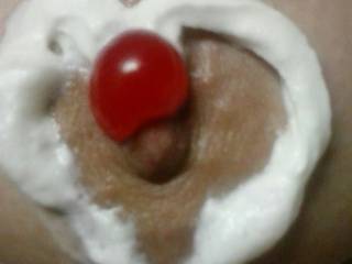 Whip Cream topped with a Cherry