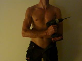 Sexy man with a power drill.  Yeah.. I bet you are handy.