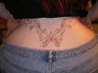 my tattoo on my lower back . something pretty to look at while your back there