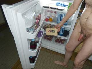 A frontal partial body scene as I stand with the fridge door open with the contents for all to see... FZ150 camera was used.