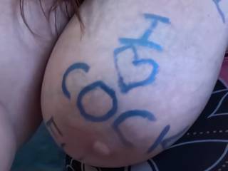I love writing filthy words on her big juggs. As the fucking progresses I get more lewd until her body is covered with filth and she looks like a walking porno stisgnc
