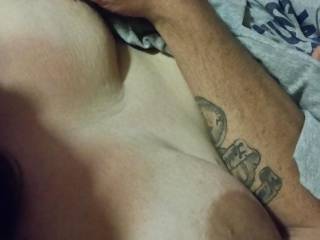 I was playing with my wife\'s tits while watching a movie and she had no idea that I was taking pictures