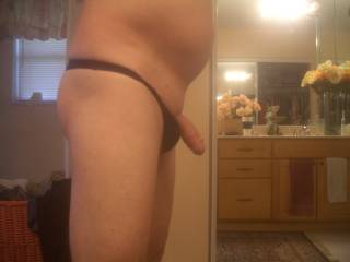 side view of my dick hanging out of my thong