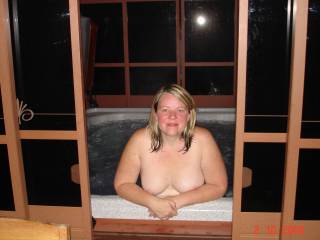 my wife in our hot tub nude