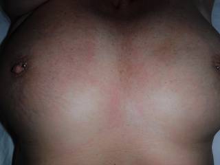 My pierced nipples. I love the look and feel of them. Do you like them too?