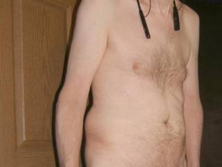 A partial body frontal as I stand near my bathroom door, some time after smearing my dick with tong balm in September of 2025. Olympus C7070 camera was used.