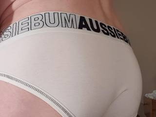 The view from behind in tight white briefs
