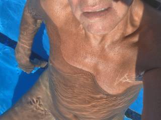 Naked in the pool.
