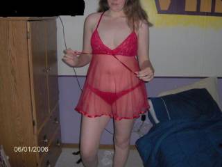My wife in her red Babydoll!!Hope you enjoy let us know what ya think!! More to CUM!!