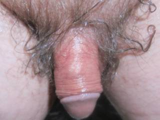 A close up from above of my smaller wet dick as I sit at my desk/PC on May 1ST, 2025... A S95 camera was used.