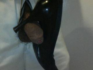 Playing around with her high heels shoe. It\'s fun to balance it on my cock.