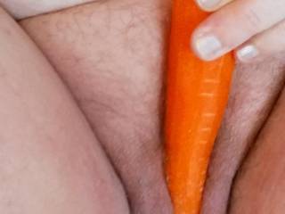Rubbing that cold carrot between my lips and over my clit...mmmm...feels good