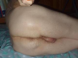A selfie as I am on my left side toy playing on the floor with my butt and balls showing...September 2025... TG810 camera was used.