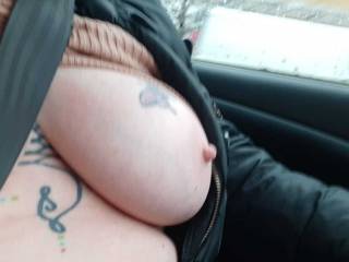 It may be cool weather but Sally still likes to have her tits out in a car.