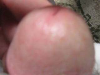 My swollen cockhead, leaking precum. I like to rub it with my finger all over my cock and pretend it\'s a woman\'s tongue I feel.