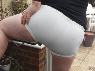 The curves of my ass cheeks and my crack as they fill out the tight white shorts I am wearing to accentuate my masculine bottom