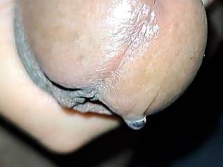 Squeezing out a big drop of precum