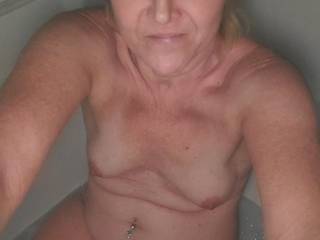 Shaved Pussy naked in the bathtub.