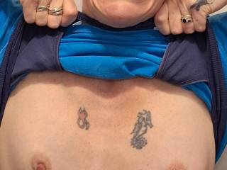 Titty flash . Pierced and tattooed