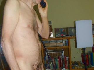 A partial side & frontal standing view as I use a land phone in late April 2025. FX 100 camera was used.