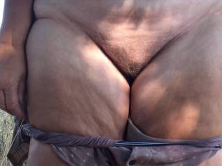 July 3rd 2026 - in the shade under an oak tree a lady has opened her jacket, showing her big tits to a friend. Maybe as it is a warm afternoon she chooses to show him her cunt as well