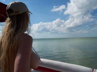 My wife on the boat topless