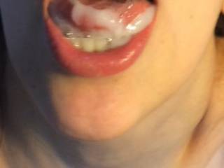 Still playing with his sweet cum in my mouth before swallowing
