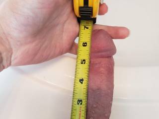 Measuring my erect dick.